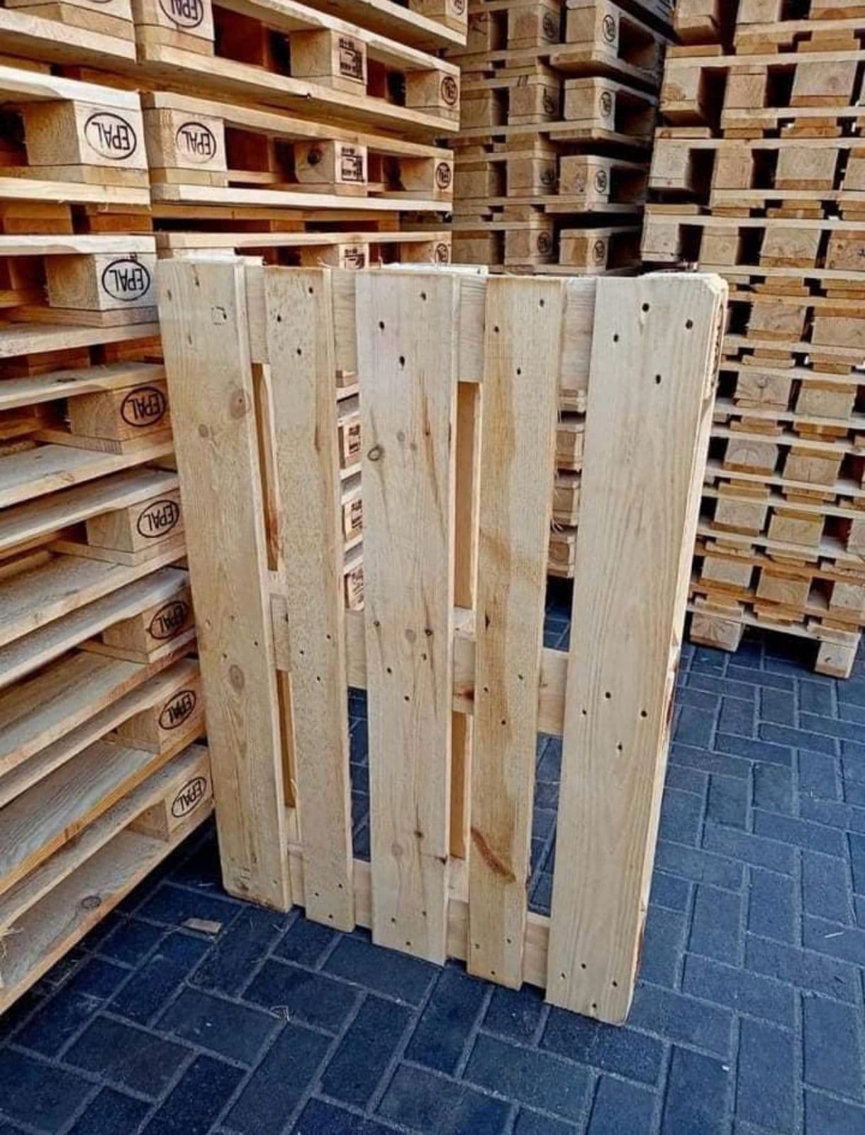 EPAL-stamped Euro pallets stacked alongside a single pallet